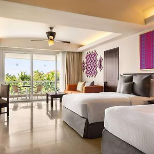 Junior Suite Two Double Beds andTropical View